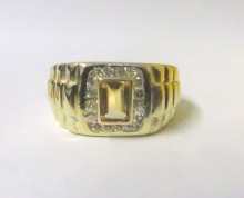 Lost center stone repaired with an emerald cut citrine.